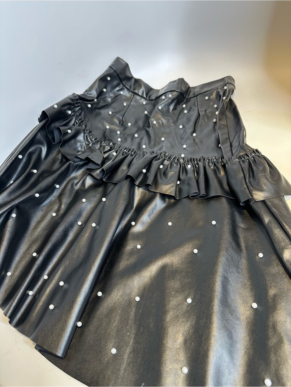 Black Faux Leather Ruffle Skirt with Pearl Studs